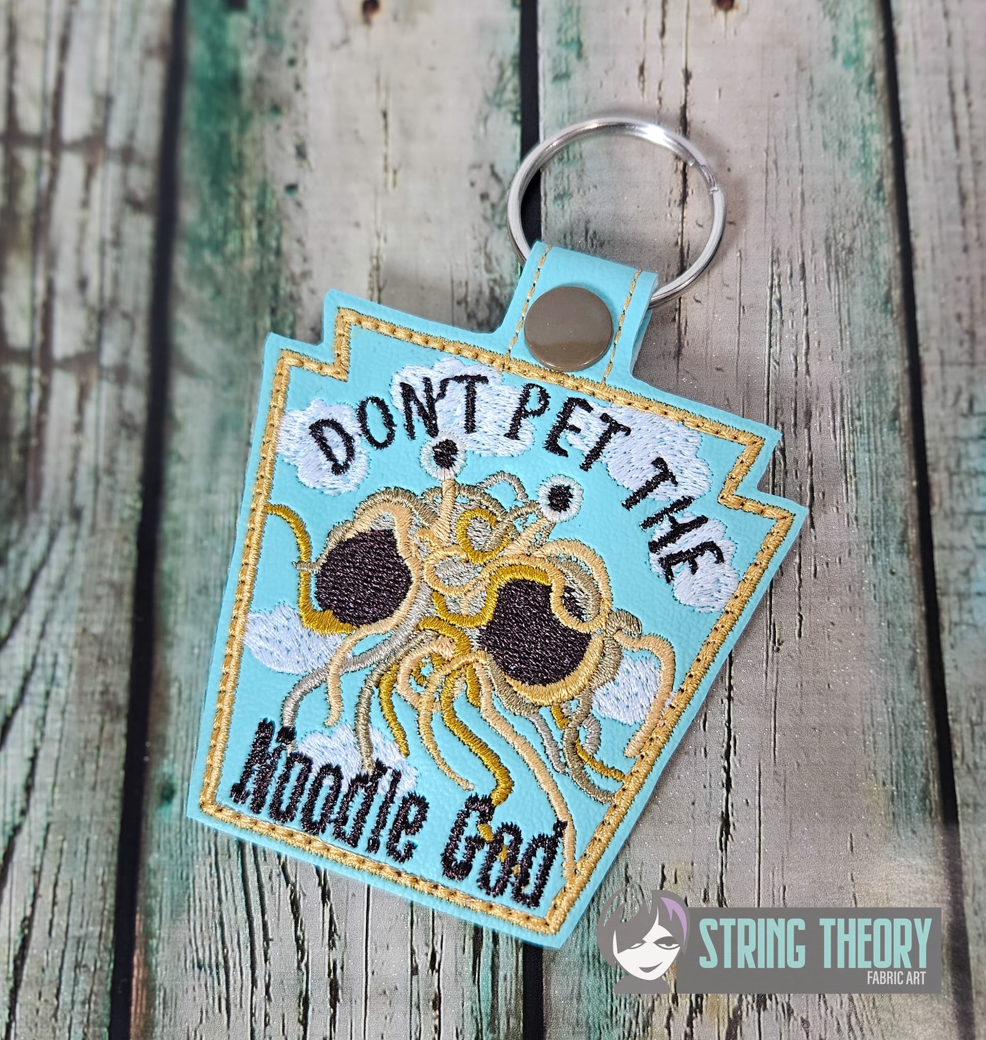 Dont Pet the Noodle God ITH fob machine embroidery design