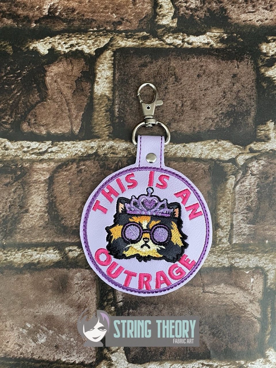 DCC This is an outrage fob patch ITH machine embroidery design