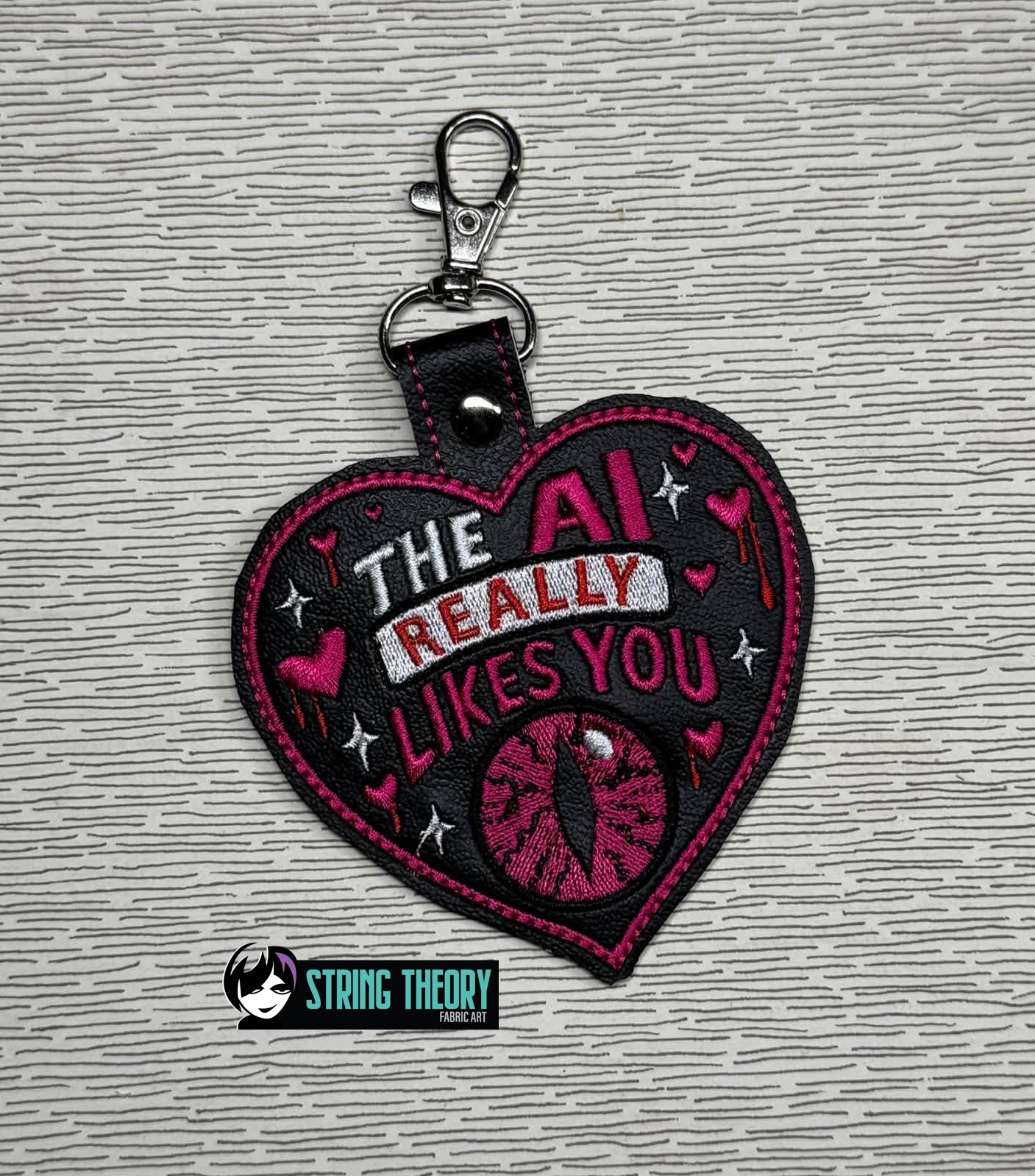 DCC – The AI Likes You fob patch ITH machine embroidery design